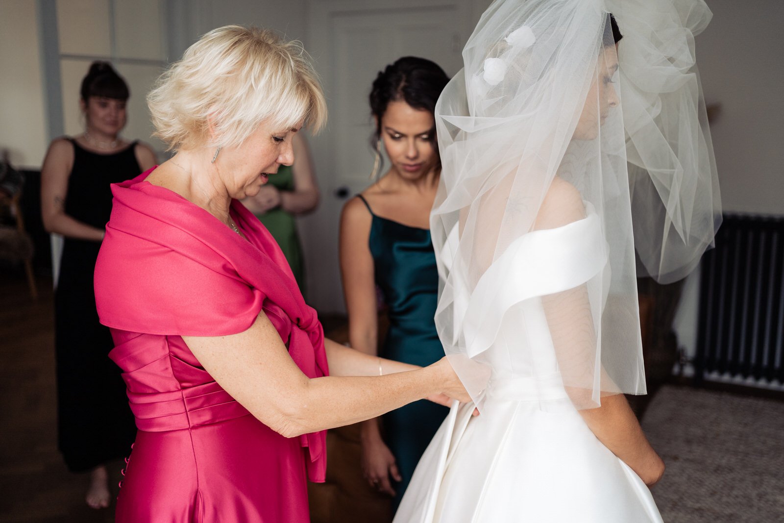 mum helping bride
