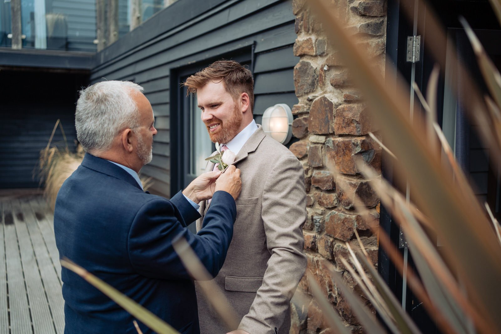 dad helping son at his wedding