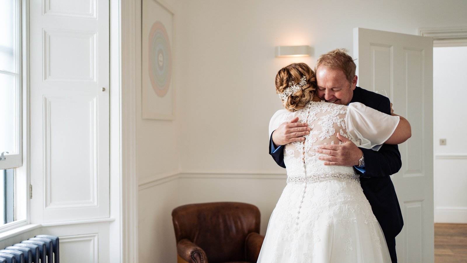 bride hugging dad