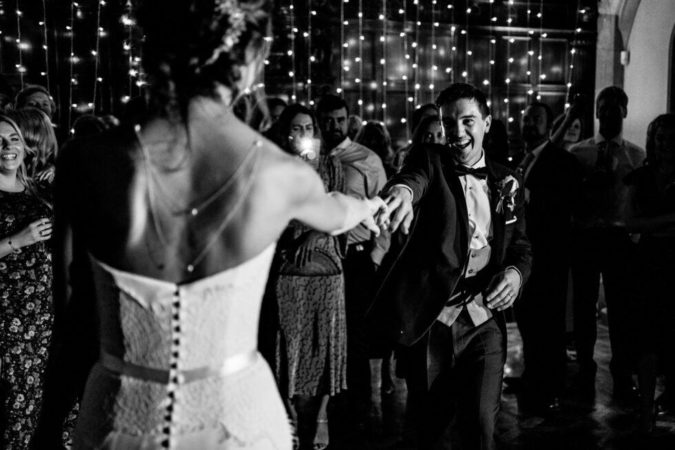 Black and white wedding first dance photo. Bride and groom dancing at Huntsham Court. Yeti Wedding Photography.