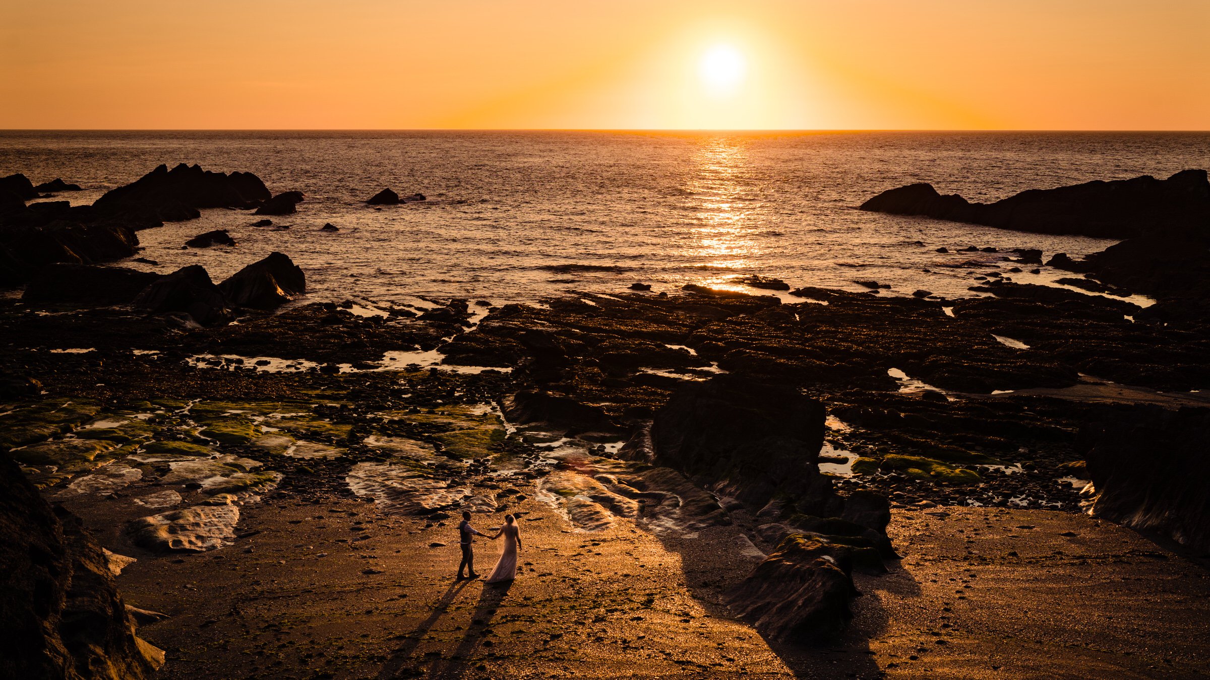 sunset - beach - wedding - couple - sea - devon - tunnels.jpg